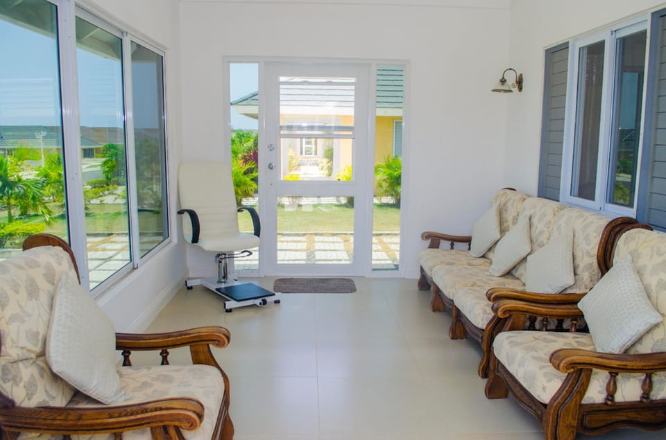 Family Villa | Living area | 50-inch flat-screen TV with cable channels, TV, DVD player