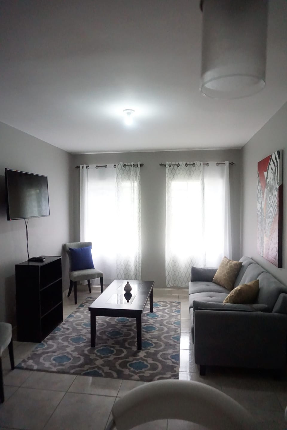 City Apartment | Living area | 50-inch flat-screen TV with cable channels, TV, DVD player