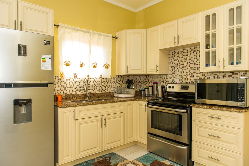 Luxury Apartment, Pool View | Private kitchen | Full-size fridge, microwave, oven, stovetop