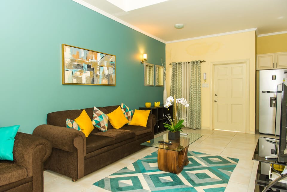 Luxury Apartment, Pool View | Living area | 50-inch flat-screen TV with cable channels, TV, DVD player