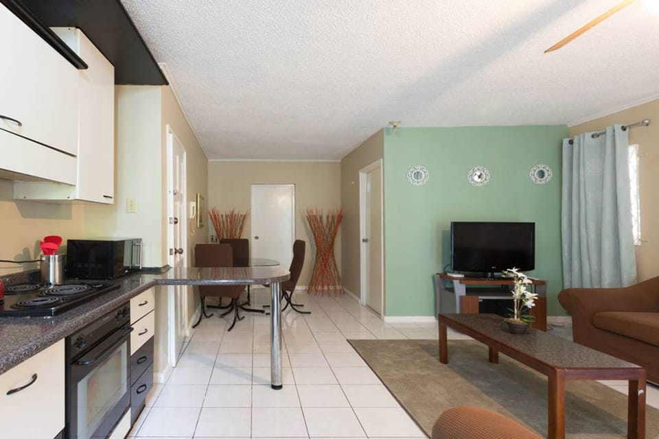 Business Apartment, Courtyard View | Living area | 50-inch flat-screen TV with cable channels, TV, DVD player