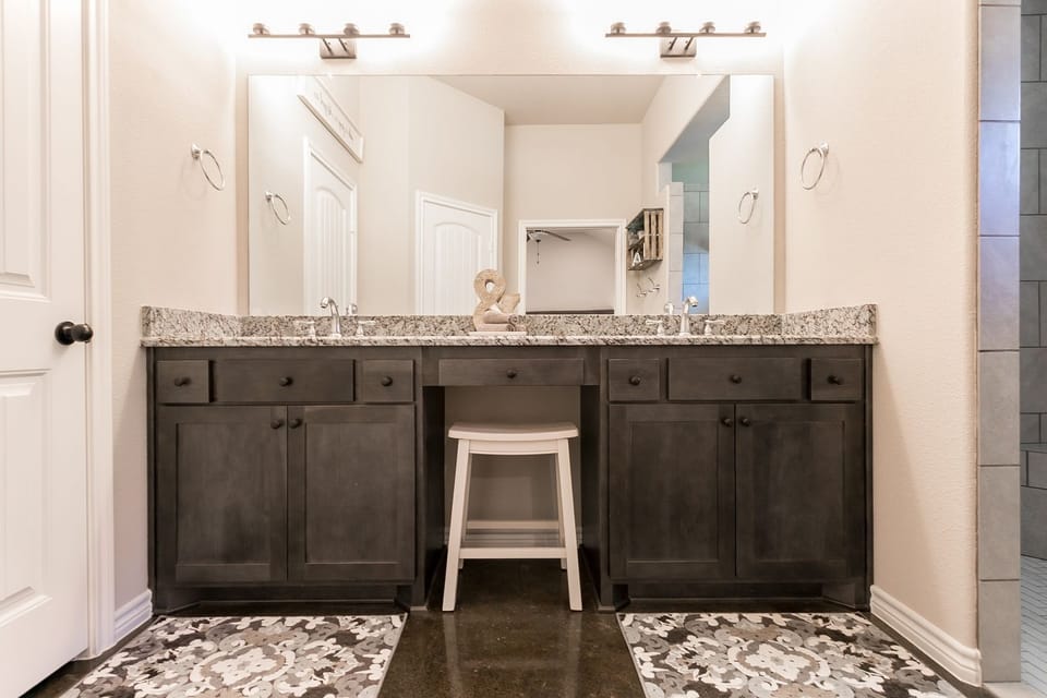 Master bathroom includes a granite double vanity