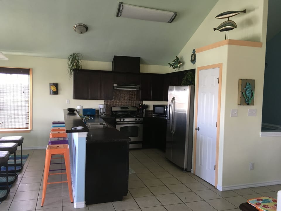 Kitchen has stainless steel full size appliances 
