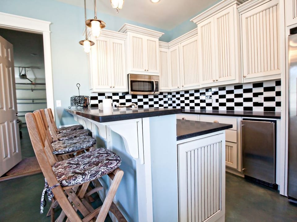 in law suite kitchen one of two,  pool lanai just outside. 