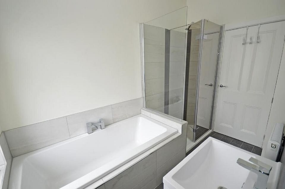 double ended bath with separate walk in shower