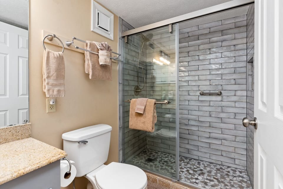 Downstairs bathroom has a walk-in shower, and towels are provided