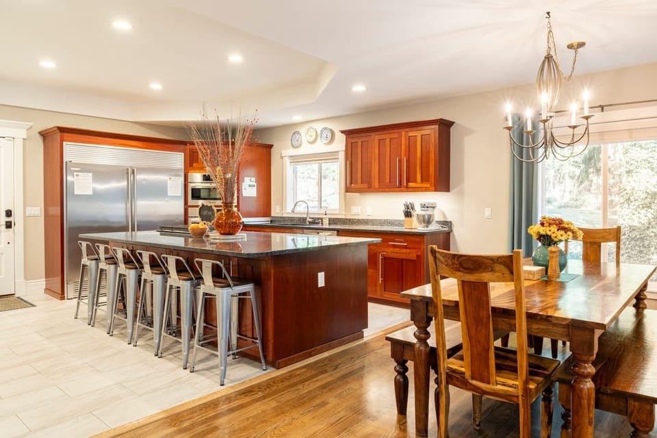 Cooking, conversations, and dining bring groups together in this chef's kitchen.