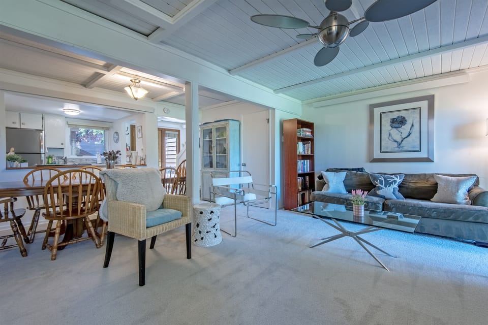 Living room and dining area (dining table has 8 chairs)