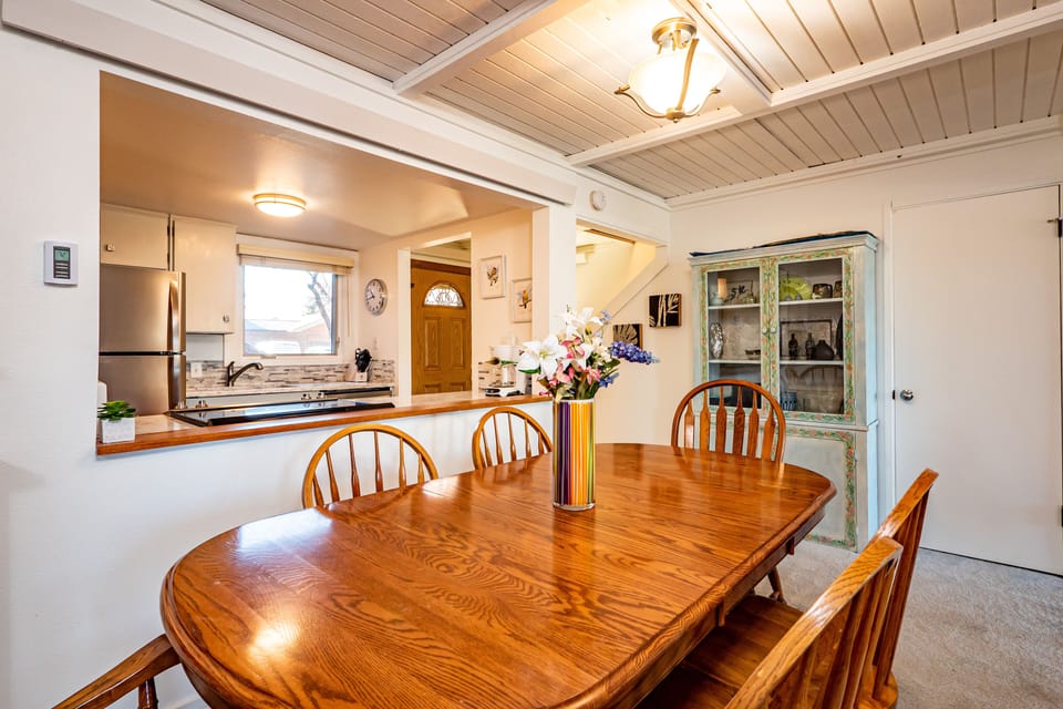 Dining table with pass through to kitchen- table opens and there are 8 chairs