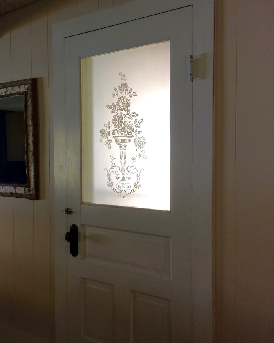 Original etched glass door to north side porch 