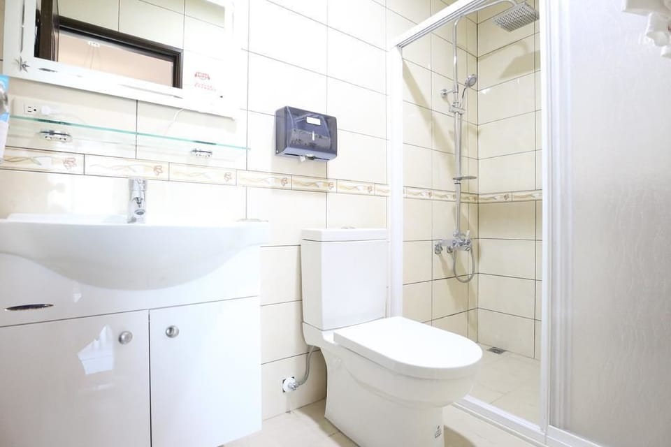 Signature Quadruple Room, 2 Double Beds, Non Smoking | Bathroom | Shower, hair dryer, slippers, towels