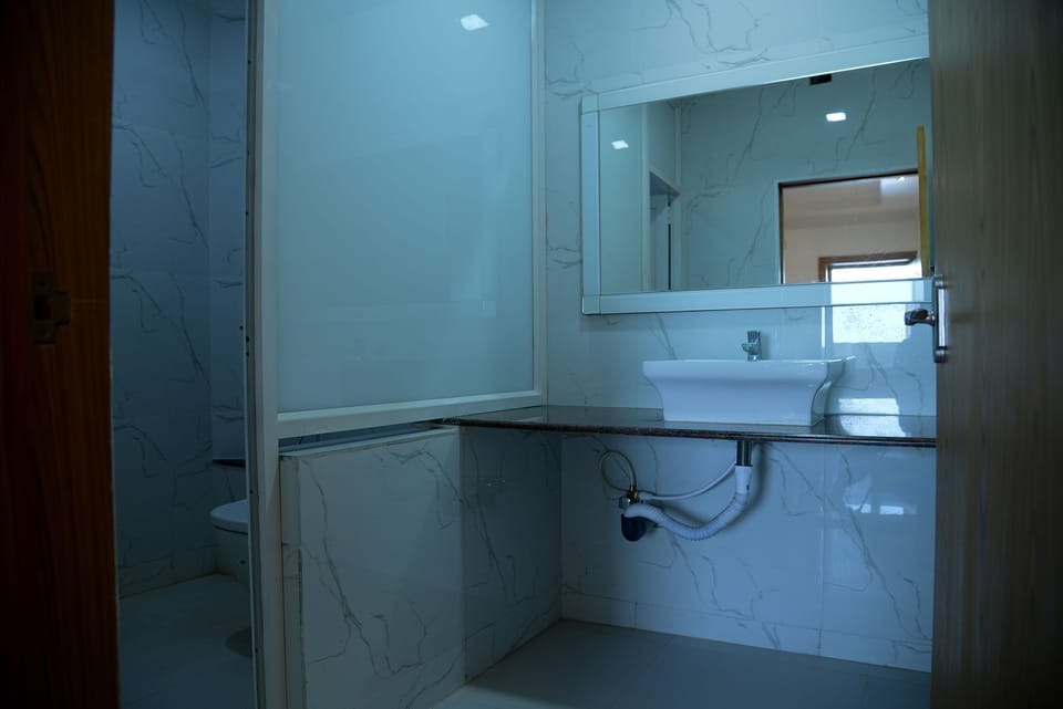 Shower, rainfall showerhead, towels