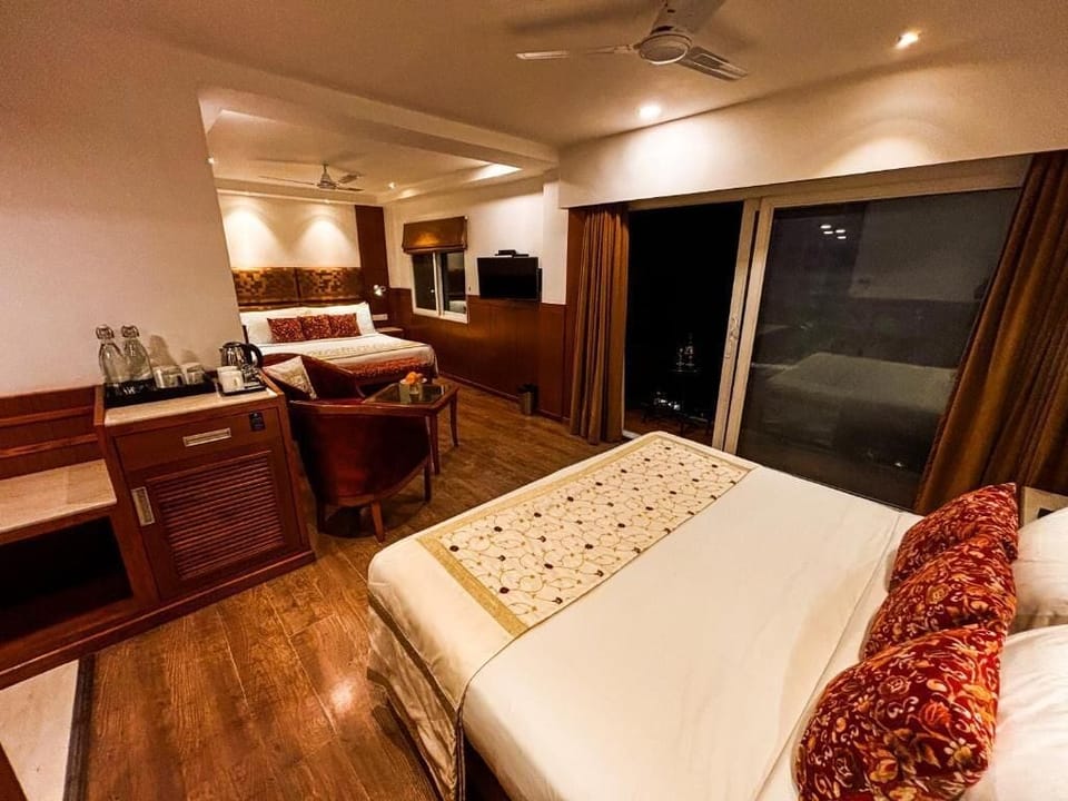 Quadruple Room, Mountain View | Premium bedding, minibar, in-room safe, laptop workspace