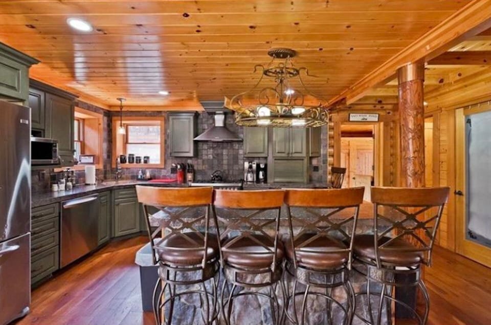Kitchen with custom concrete countertops, stainless steel high end appliances