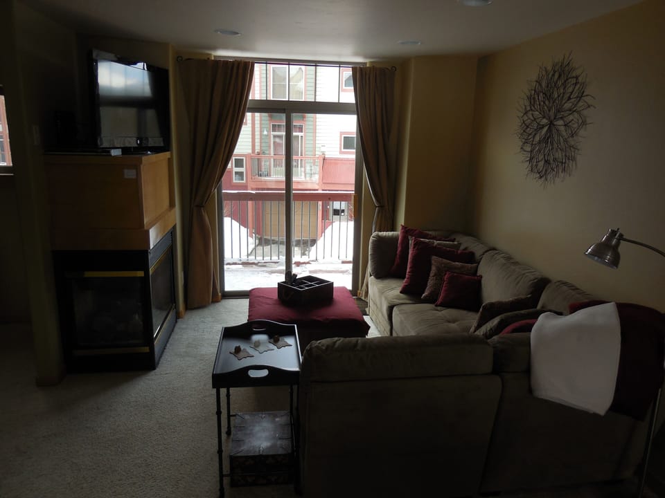 Living room on main/second floor. Gas fireplace turns on by light switch.