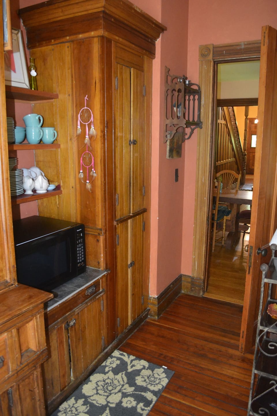 Butler pantry with microwave oven, sink and Cuisinart K-cup machine.  