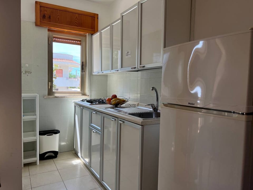 Fridge, stovetop, coffee/tea maker, cookware/dishes/utensils