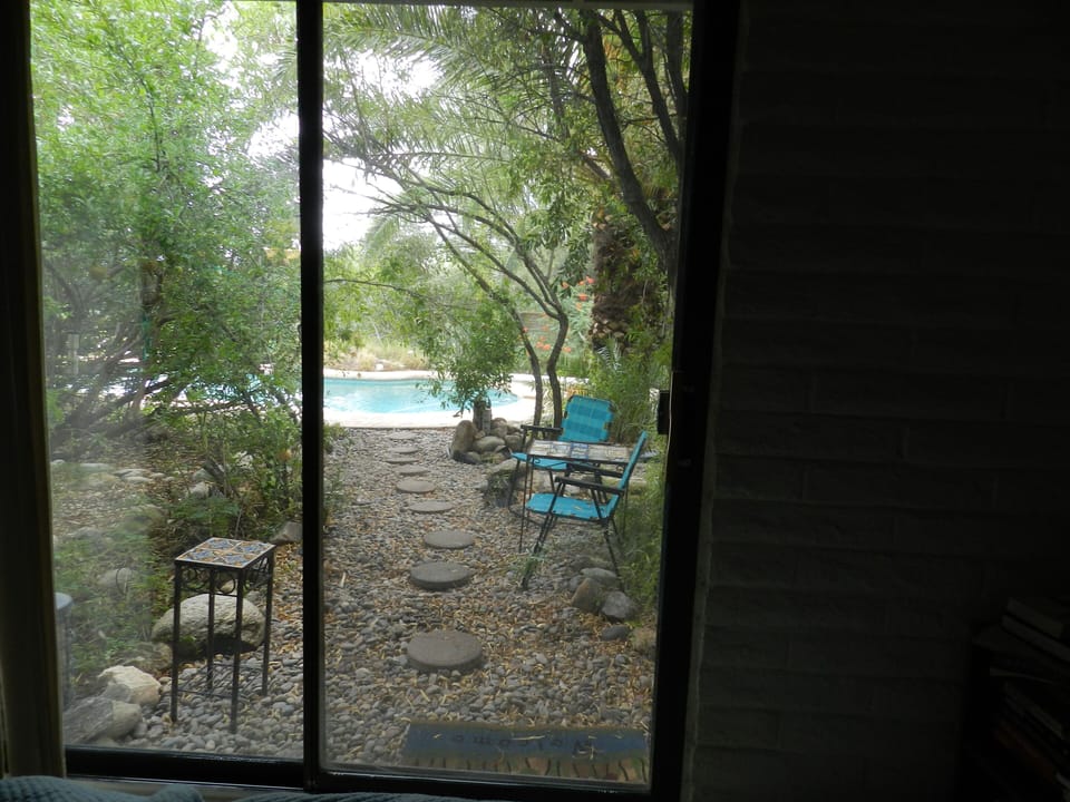 view from bedroom to pool