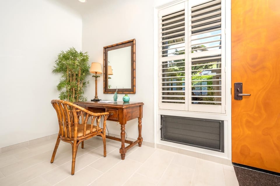 Welcome home! A cozy workspace by the window, perfect for planning island adventures    
