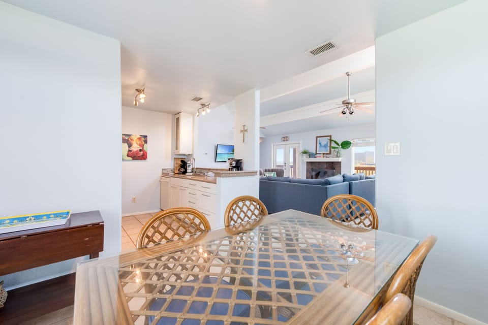 Gather around this inviting mosaic dining table where your group can share memorable meals in this bright, open-concept space.