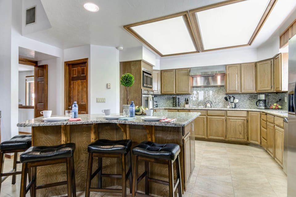 Kitchen well equipped; plenty of storage in pantry and roomy cupboards