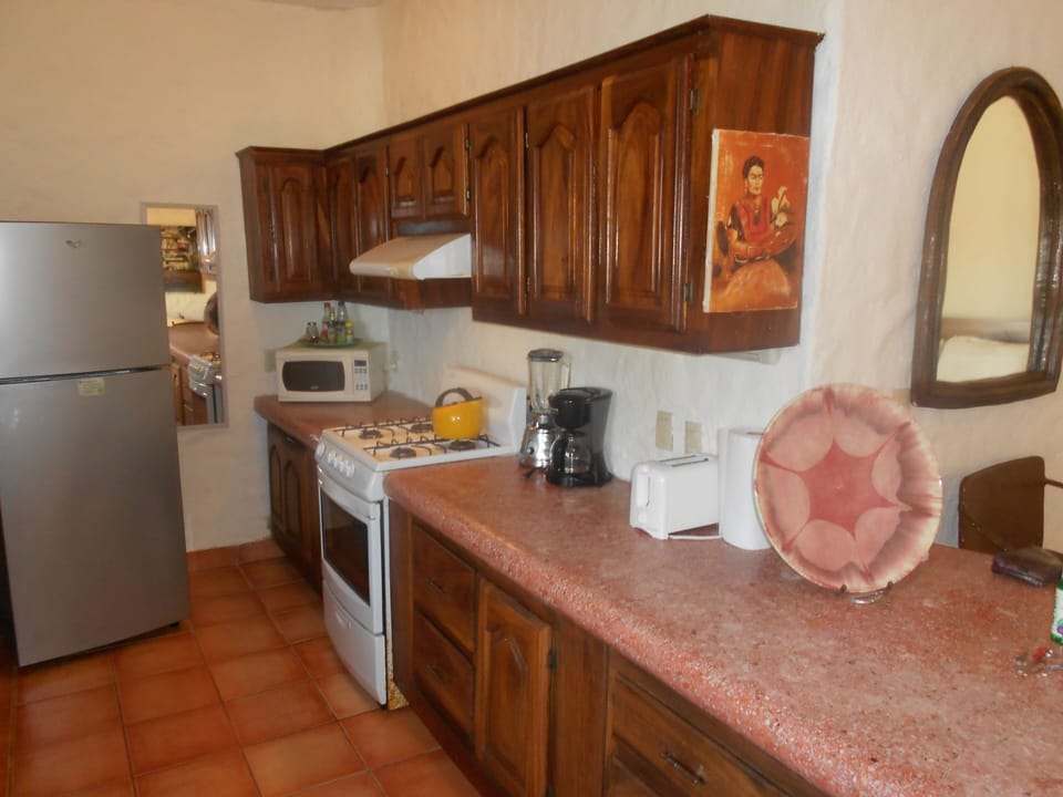 Upper level 2 kitchen--pots, pans, dishes, microwave, toaster, blender, gas stov
