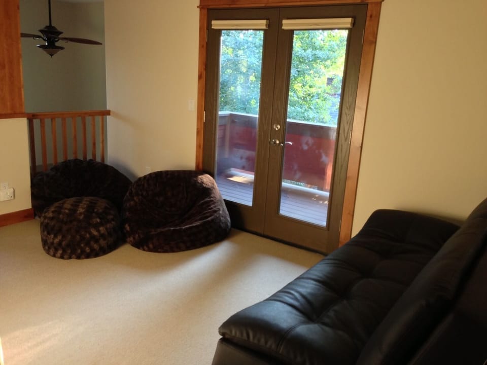 Loft with west facing deck and balcony over living room. Great TV/game area.