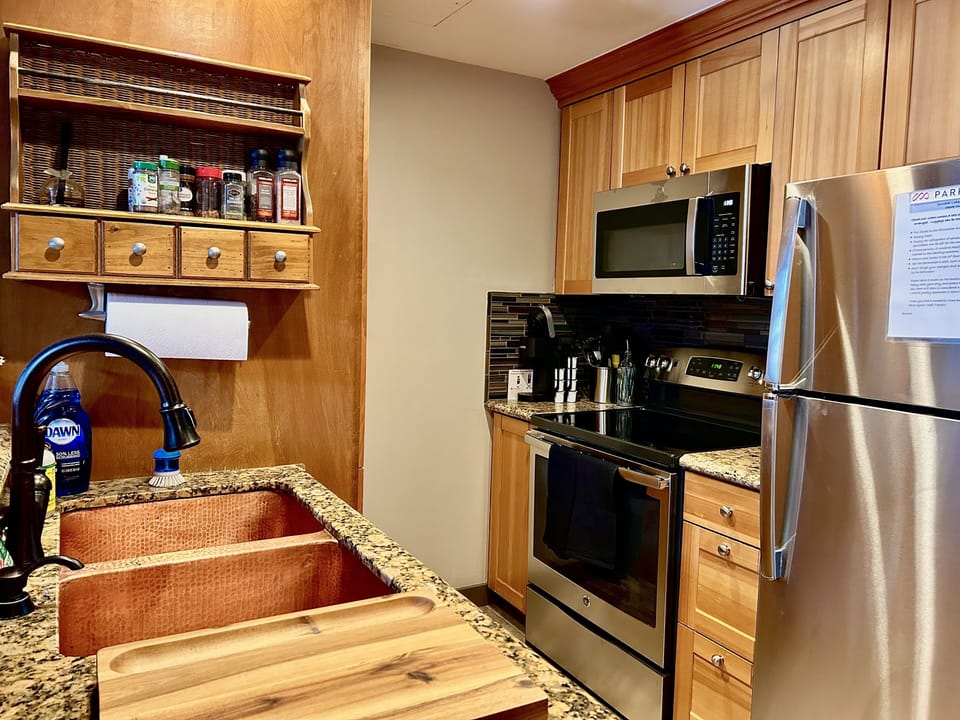 Well appointed kitchen with granite countertops and stainless appliances