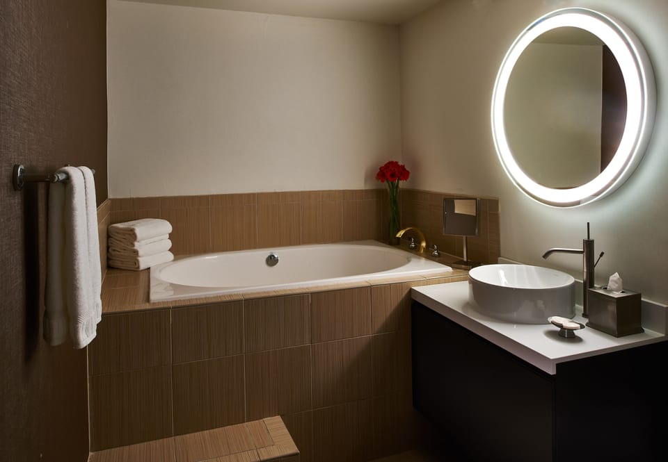 Combined shower/tub, designer toiletries, hair dryer, bathrobes