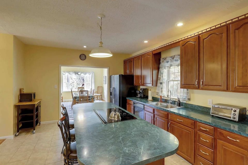 Kitchen seats up to 13 people (w/ table leaf and extra chairs).