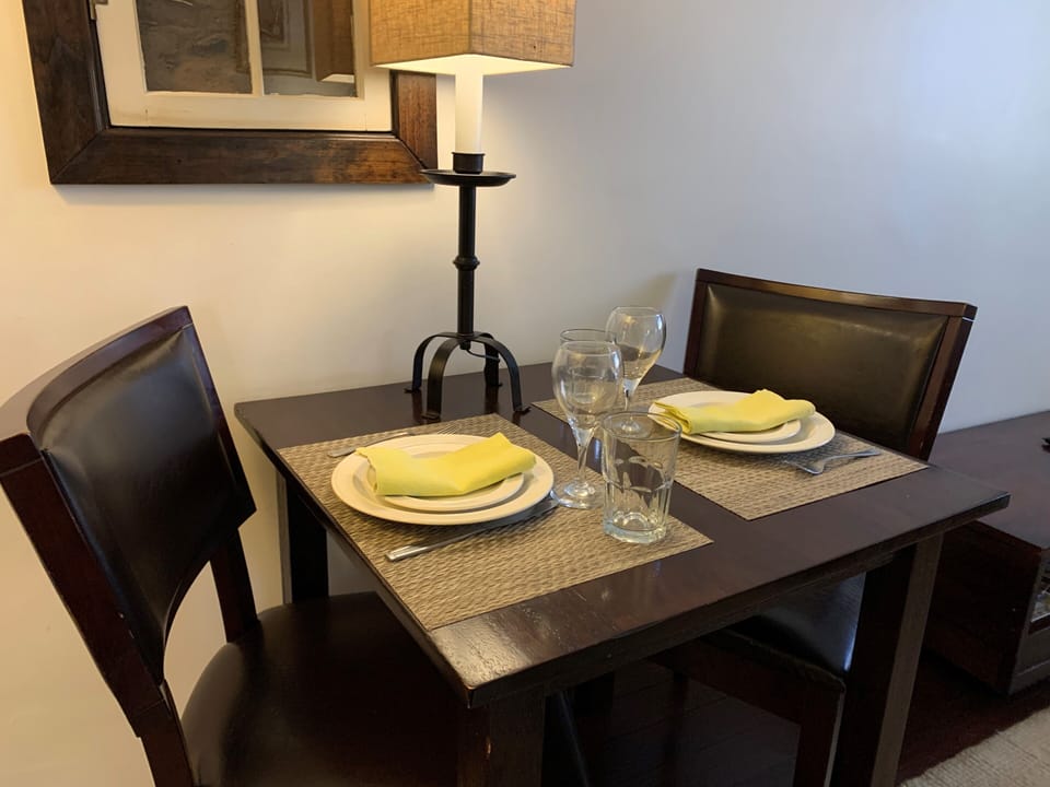 Table next to window showing existing adobes wall. Bussines Comcast internet .