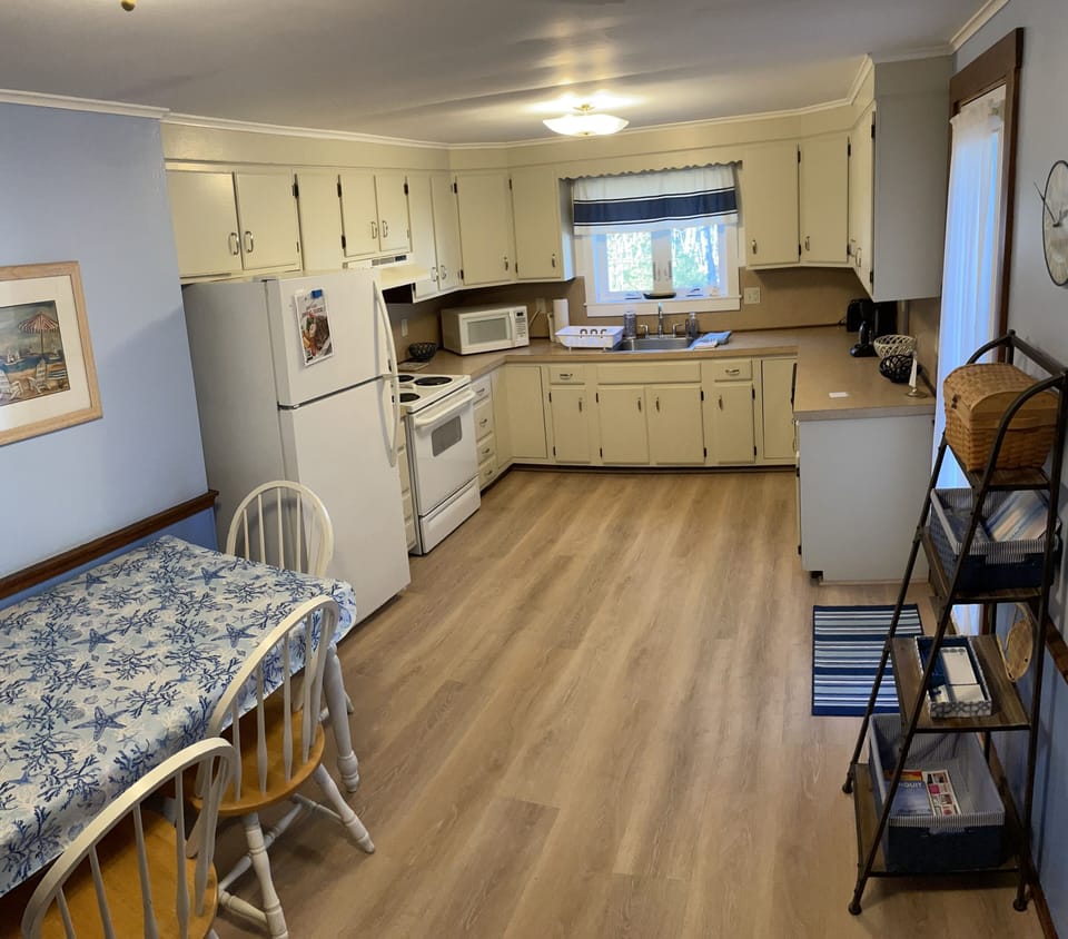 Large eat-in kitchen leads out to back deck