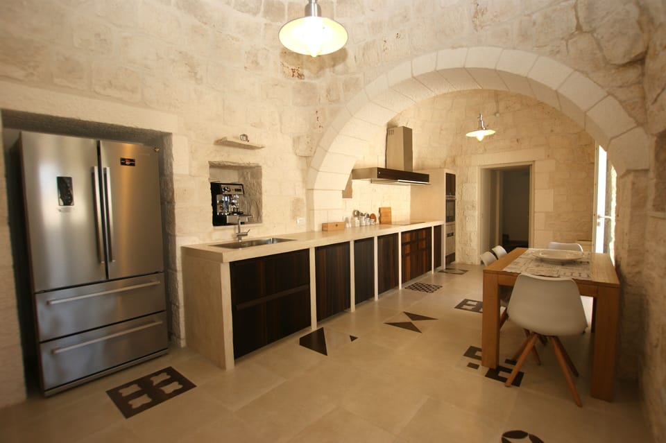 Kitchenette inside with dishwasher, stove, oven, fridge and much more.
