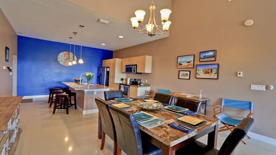 Dining room seats six + three at kitchen counter