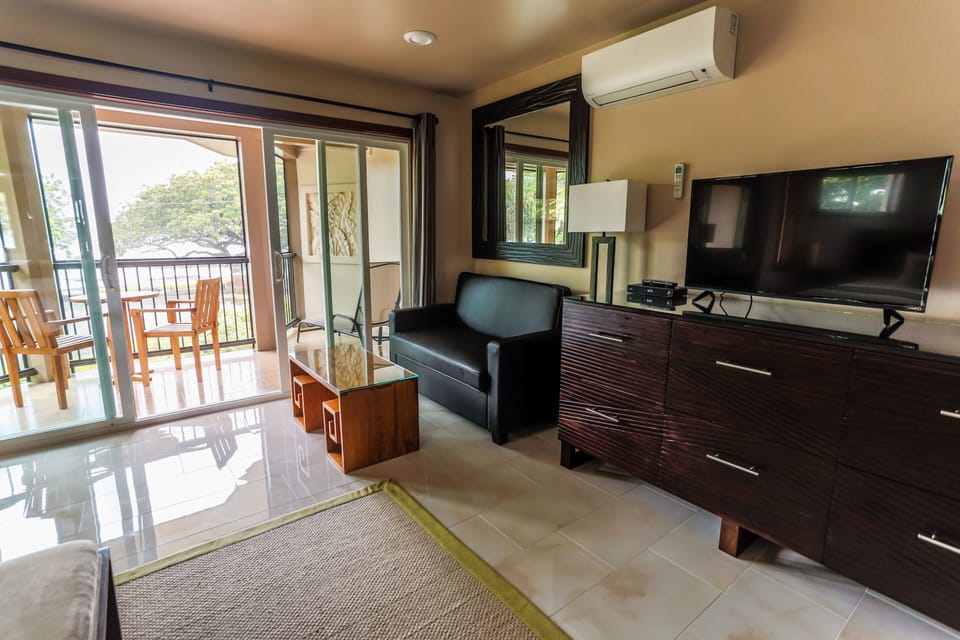 Luxury oceanfront room with a twin sofa sleeper and split air conditioning.