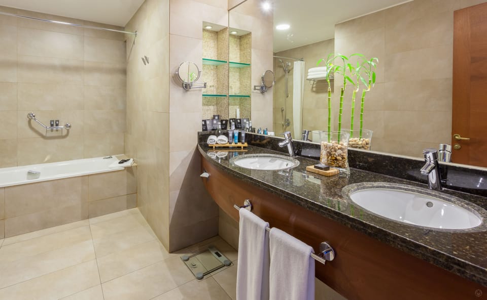 Bathroom | Deep soaking tub, free toiletries, hair dryer, bathrobes