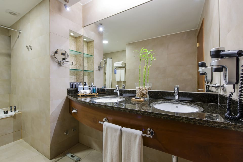 Bathroom | Deep soaking tub, free toiletries, hair dryer, bathrobes