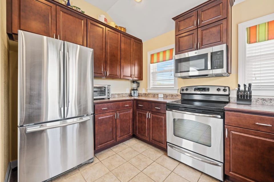 Kitchen with Bar Seating on Third Level