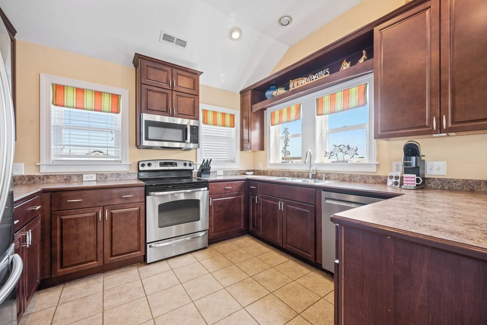 Kitchen with Bar Seating on Third Level