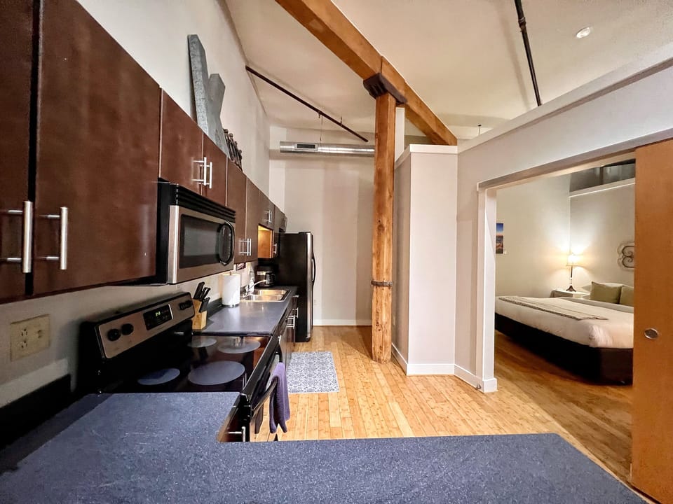 The 2nd bedroom is located off of the kitchen area.