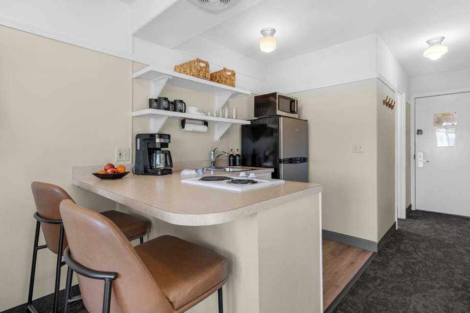 One Bedroom Suite, Some with Fireplace | Private kitchen | Fridge, microwave, dishwasher, coffee/tea maker