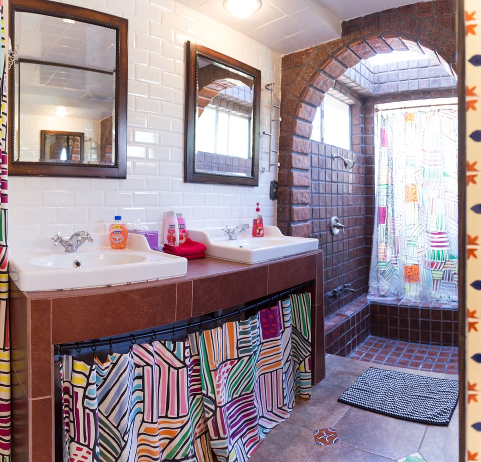 One of Main Floor Bathrooms with Huge Sunken Walk-In Shower, Double Sinks 