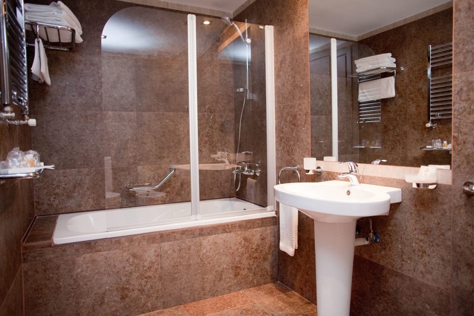 Combined shower/tub, hair dryer, bathrobes, slippers