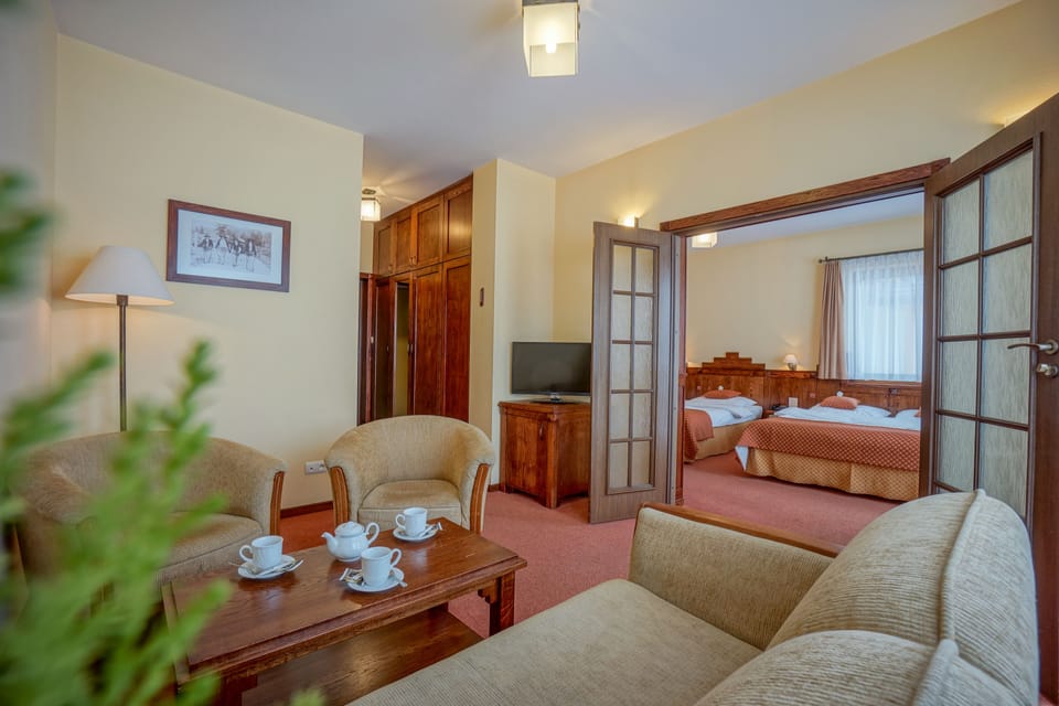 Premium Suite, Balcony, Mountain View | Living area | 32-inch LED TV with digital channels, TV