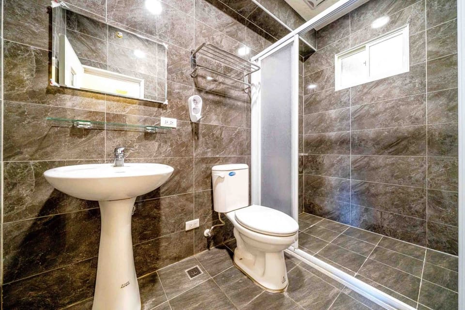 Family Room (401) | Bathroom | Hair dryer, slippers, towels, toilet paper