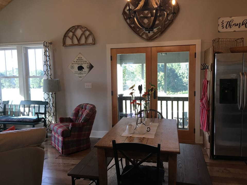 In the dining area looking at the screened in porch 