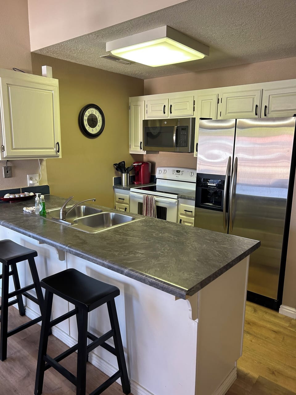 Fully stocked kitchen with dishwasher.