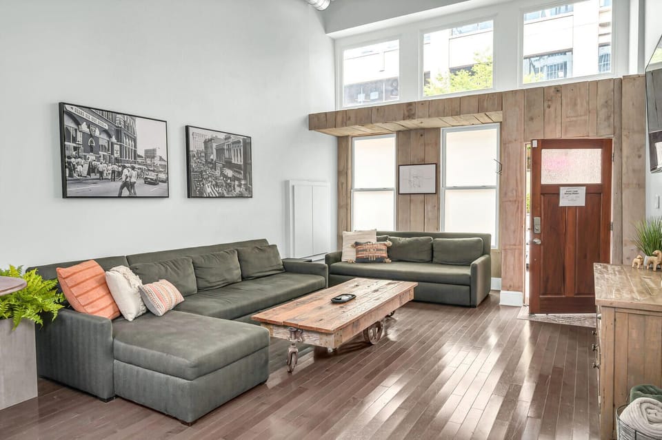 Spacious living room with two luxury queen sleeper sofas to sleep 4 guests