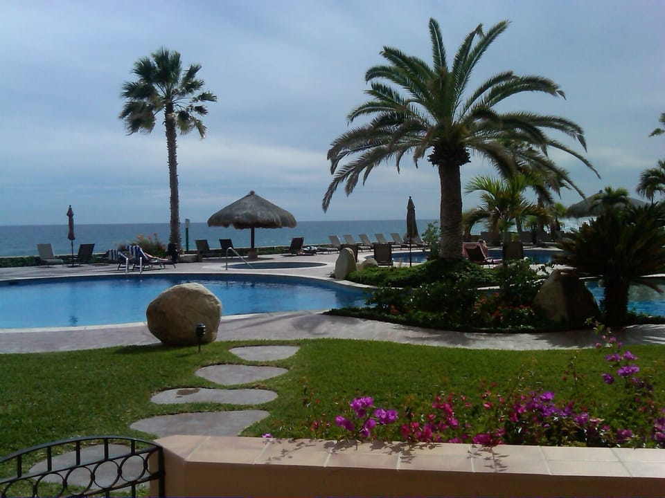 Ocean and pool are only steps from the patio.