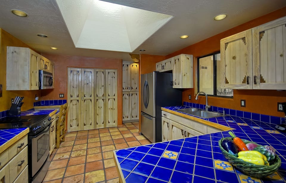 Fully equipped Mexican style kitchen.  Full sized laundry behind double doors